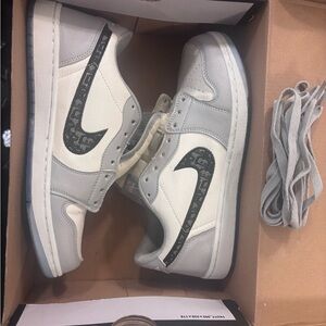 Nike White and Gray Sneakers with Black Swoosh